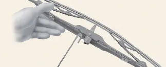 Installing a new wiper blade assembly onto the Kia Carnival