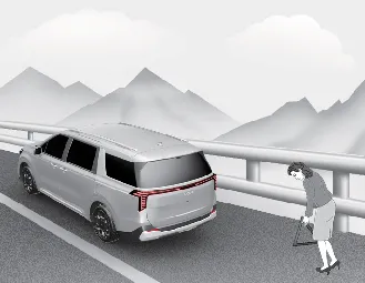 Engaging the parking brake on a Kia Carnival before changing a tire