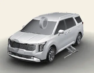 Properly blocking wheels for safety while jacking a Kia Carnival
