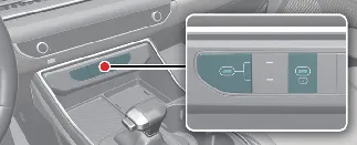 USB charging ports located on the front console of the Kia Carnival