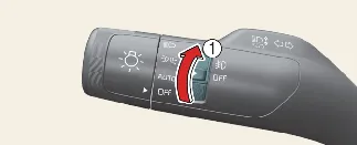 Operating the fog light switch on the Kia Carnival stalk