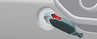 Positioning smart key against the ENGINE START/STOP button