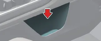 Convenient open storage tray on the passenger side of the Kia Carnival